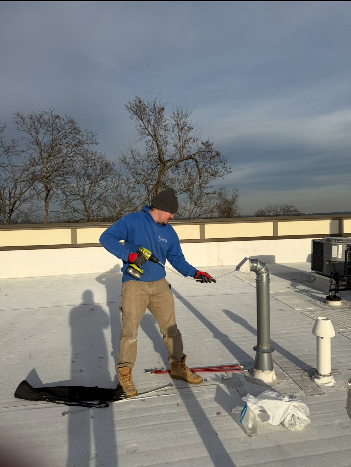 A Lint Guys technician servicing a dryer vent in Morris County, NJ